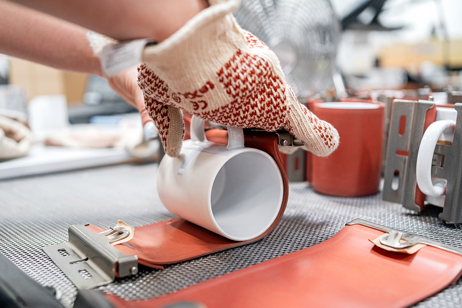 Close-up of customized mug production